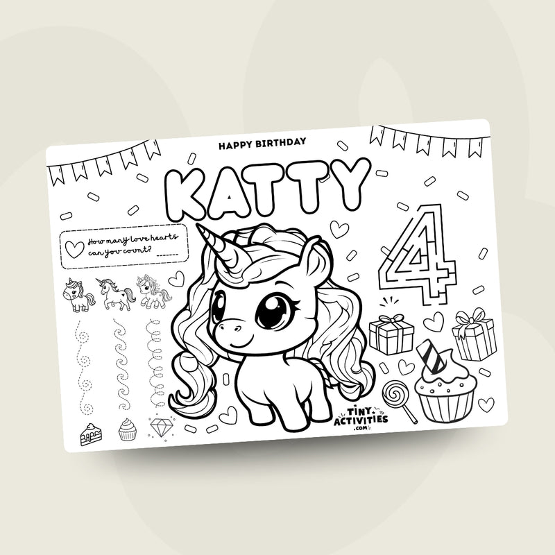 A cute unicorn coloring placemat for kids with a smiling unicorn, stars, rainbows and simple shapes to colour in. Easy to print at home and perfect for keeping little ones entertained during meals or playtime.